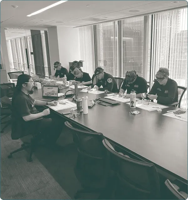 First responders seated around a conference table during a street wound care training session