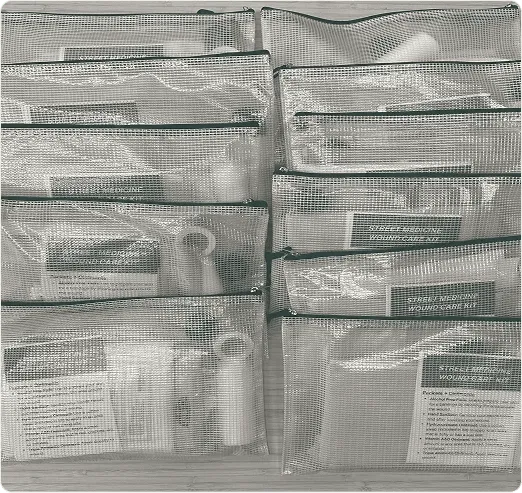 Rows of zippered Street Wound Foundation wound care kit bags